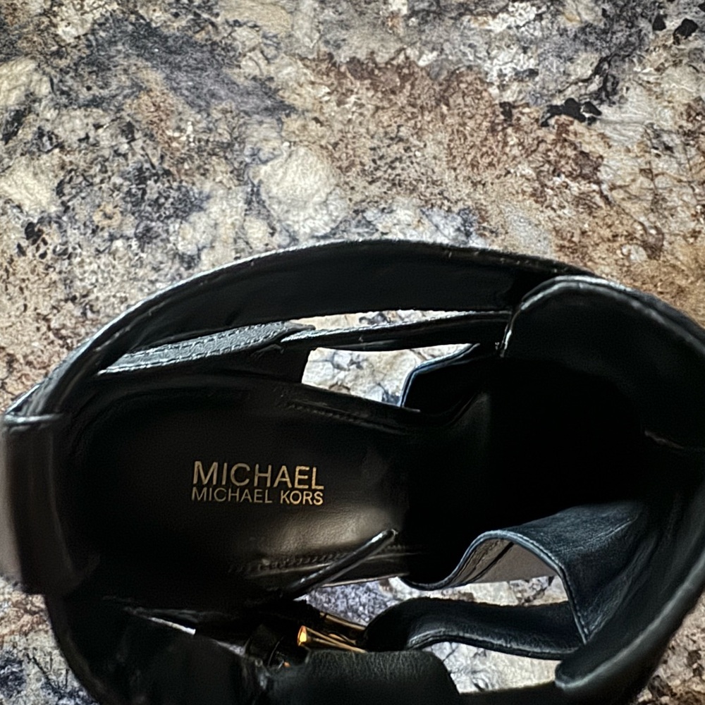 Gently used Michael Kors 4” inch leather heels with gold straps. Size 7.5